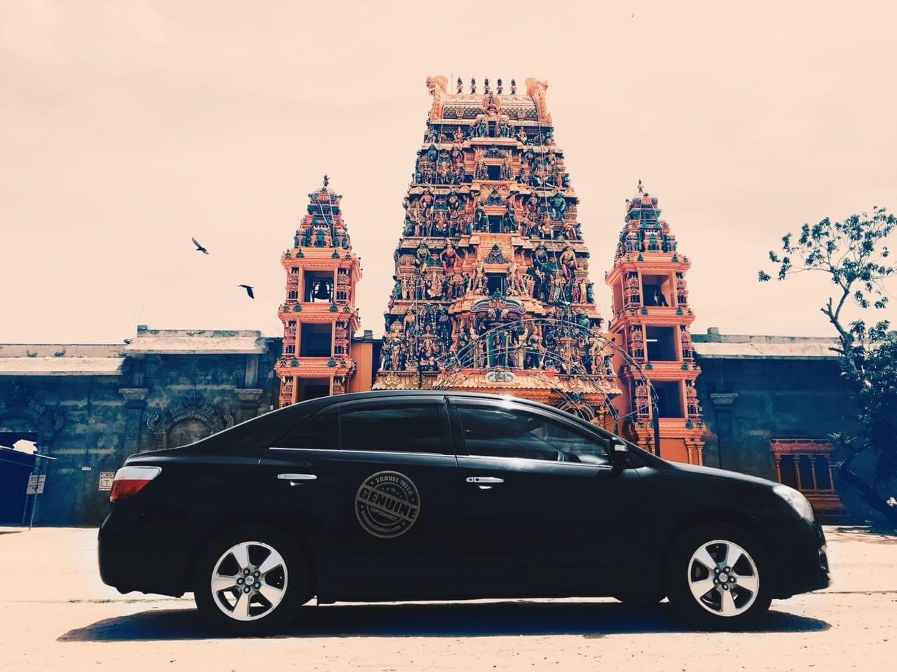 Branded tour car at a colourful Hindu temple in Colombo